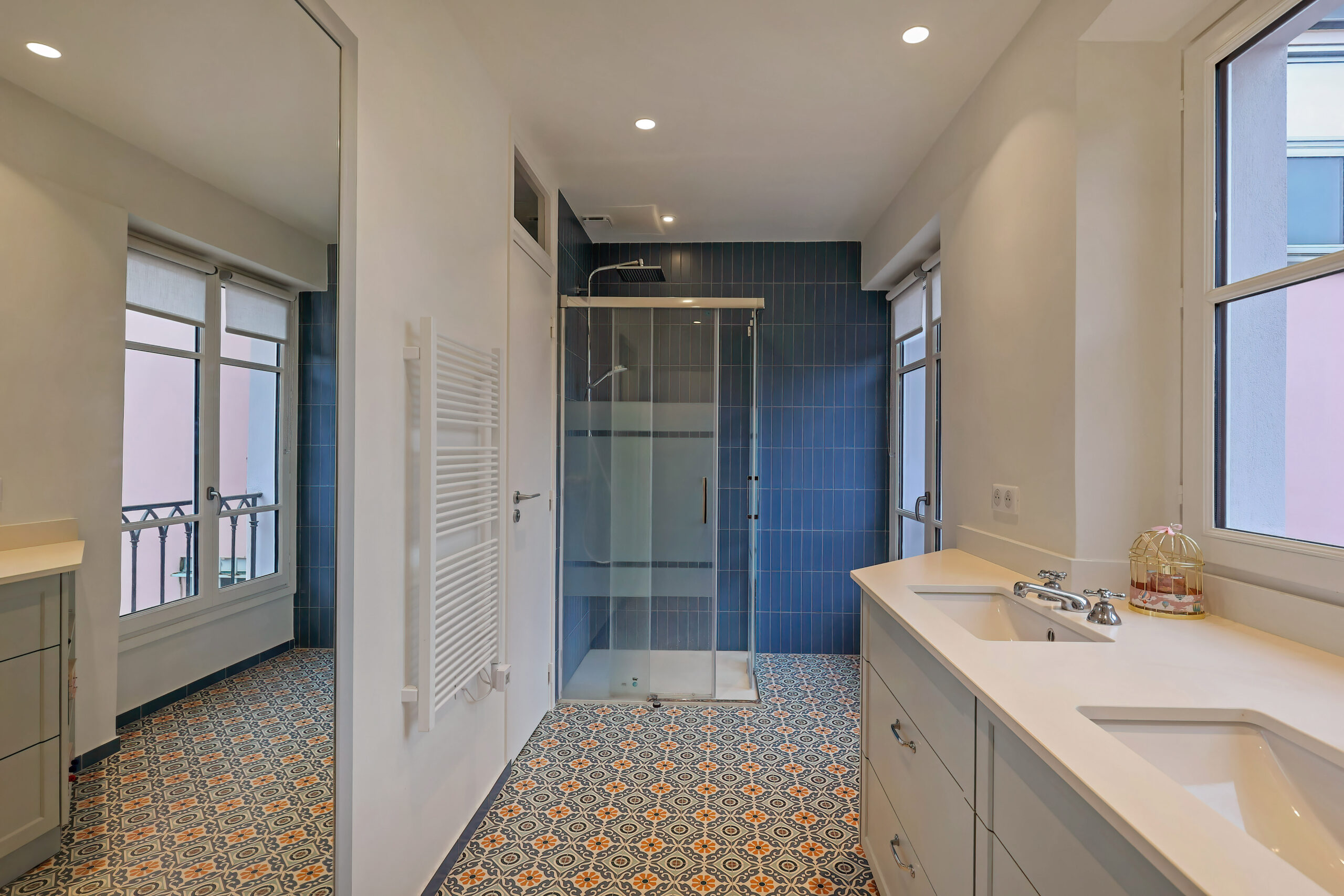 The children's bathroom, with a large mirror that reflects the garden.