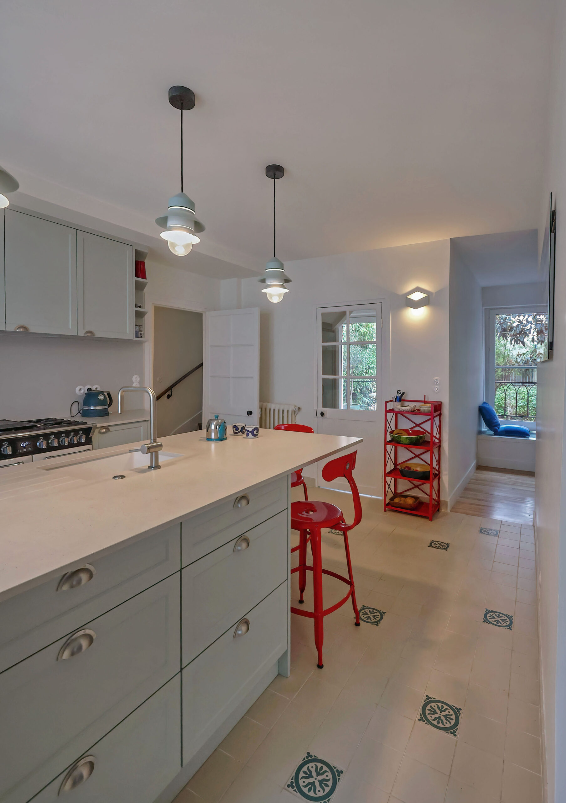 The custom-made kitchen, with Stone Italiana quartz tops. Interior designer Flora Auvray